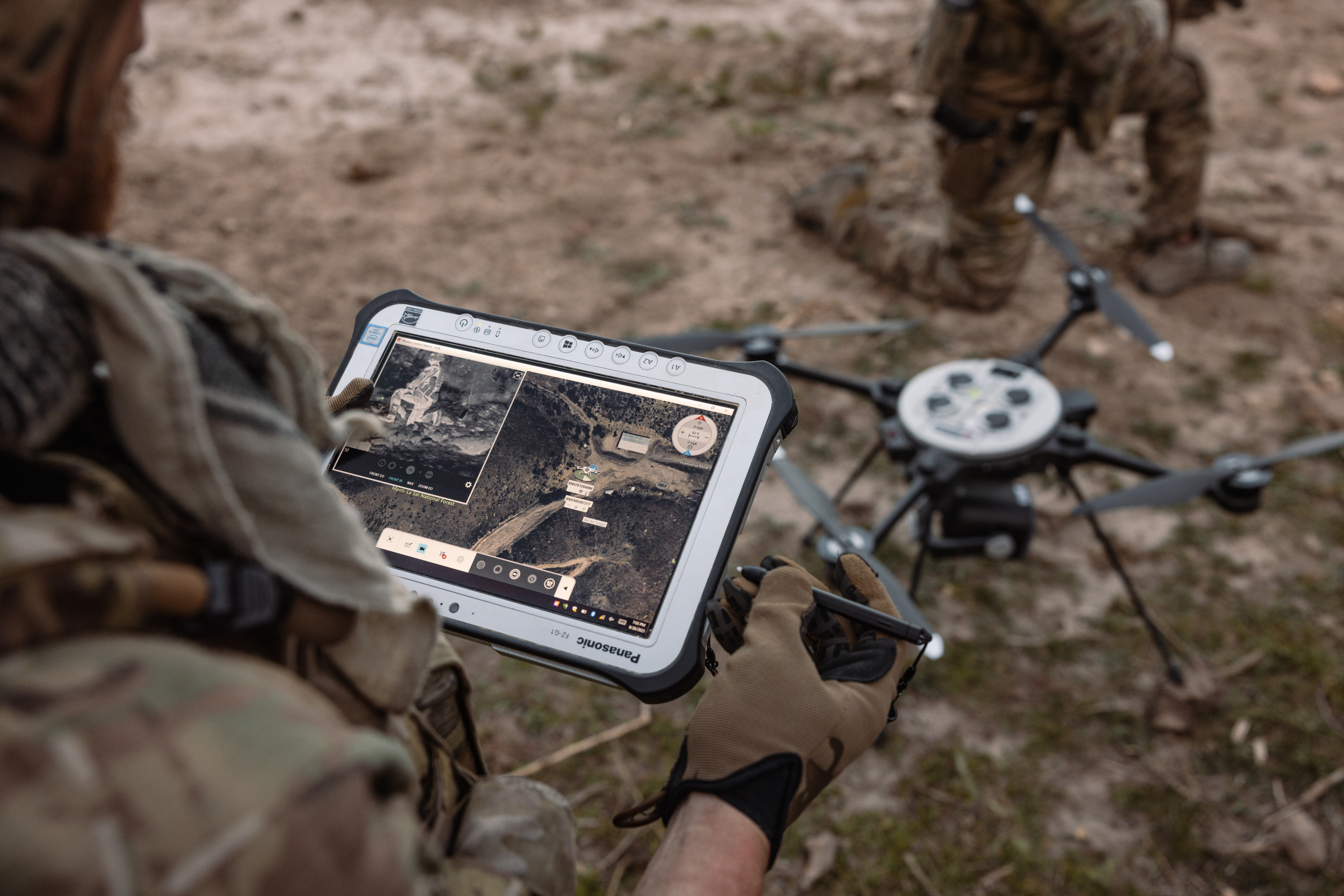 Soldier operating GPS device for drones